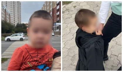 Астанада жеңіл киінген кішкентай бала көшеде жалғыз жүрген