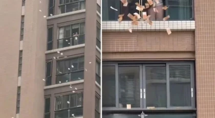 "Аспаннан ақша жауды": Әйел терезеден 60 миллион теңгені шашқан