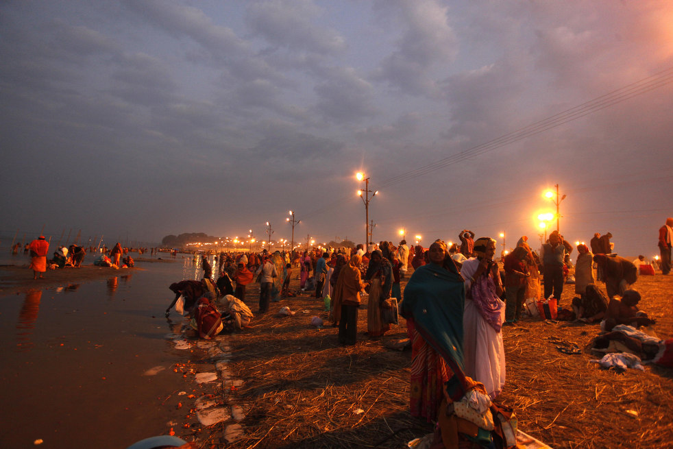 Hindu devotees pray at Sangam, the confluence of rivers Ganges, Yamuna and the mythical Saraswati during the annual month long Hindu religious fair of Magh Mela in Allahabad, India,   Friday, Jan.27, 2012. Hundreds of thousands of devout Hindus bathe at the confluence during the astronomically auspicious period of over 45 days celebrated as 'Magh Mela'. (AP Photo/Rajesh Kumar Singh)