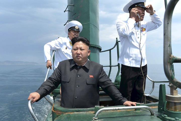 North Korean leader Kim Jong Un (front) stands on the conning tower of a submarine during his inspection of the Korean People's Army (KPA) Naval Unit 167 in this undated photo released by North Korea's Korean Central News Agency (KCNA) in Pyongyang June 16, 2014 in this file photo. North Korea is "likely" to have conducted a nuclear test on January 6, 2016 that caused an earthquake near a known testing site in the isolated country, the South Korean and Japanese governments said. REUTERS/KCNA/Files ATTENTION EDITORS - THIS PICTURE WAS PROVIDED BY A THIRD PARTY. REUTERS IS UNABLE TO INDEPENDENTLY VERIFY THE AUTHENTICITY, CONTENT, LOCATION OR DATE OF THIS IMAGE. FOR EDITORIAL USE ONLY. NOT FOR SALE FOR MARKETING OR ADVERTISING CAMPAIGNS. THIS PICTURE IS DISTRIBUTED EXACTLY AS RECEIVED BY REUTERS, AS A SERVICE TO CLIENTS. NO THIRD PARTY SALES. NOT FOR USE BY REUTERS THIRD PARTY DISTRIBUTORS. SOUTH KOREA OUT. NO COMMERCIAL OR EDITORIAL SALES IN SOUTH KOREA