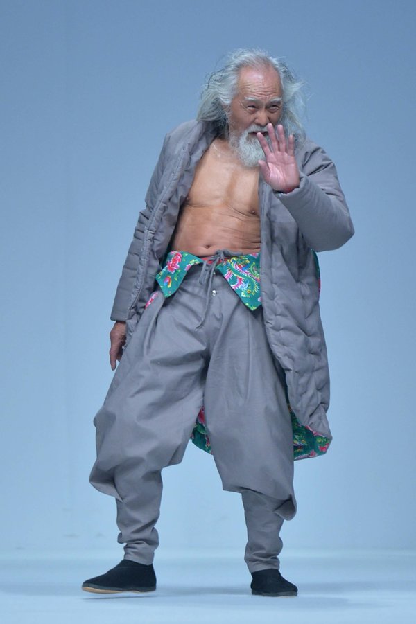 "79-year-old Chinese actor Wang Deshun displays a new creation by Chinese fashion designer Sheguang Hu at the Sheguang Hu fashion show during the China Fashion Week Fall/Winter 2015 in Beijing, China, 25 March 2015."