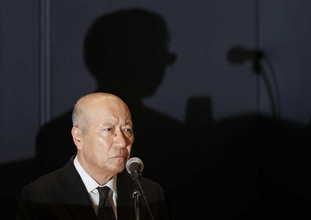 President of the top Japanese advertising company Dentsu Inc. Tadashi Ishii attends a press conference at the company's headquarters in Tokyo, Wednesday, Dec. 28, 2016. President Ishii will step down to take responsibility for the suicide of a worker who had clocked massive overtime. (Kyodo News via AP)